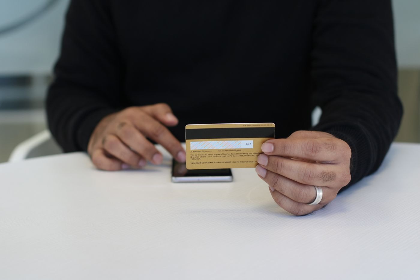 A person comparing two bank cards