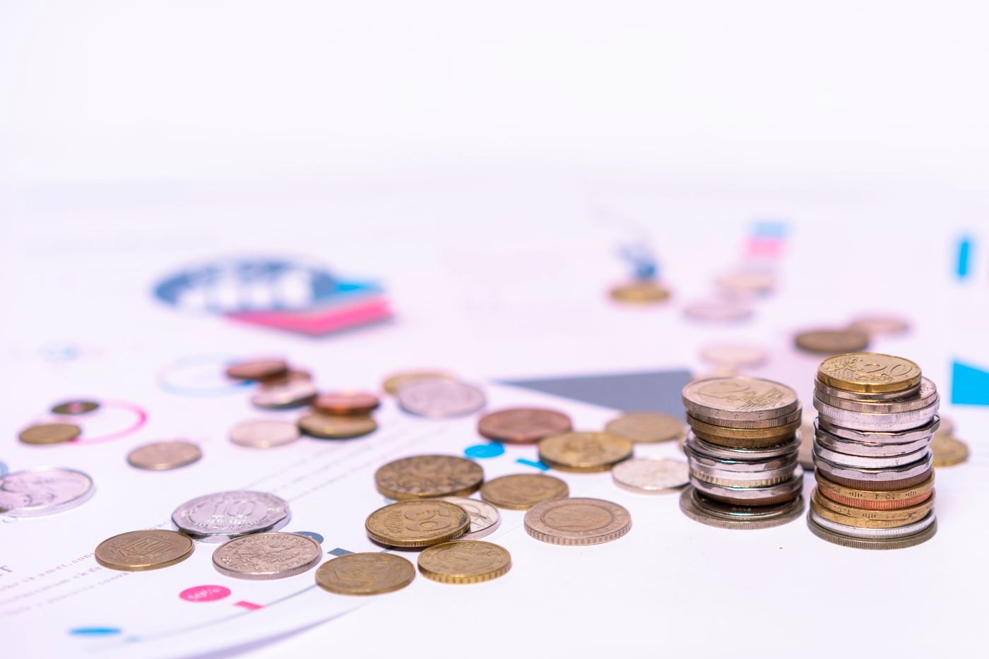 Coins laid out on a white surface