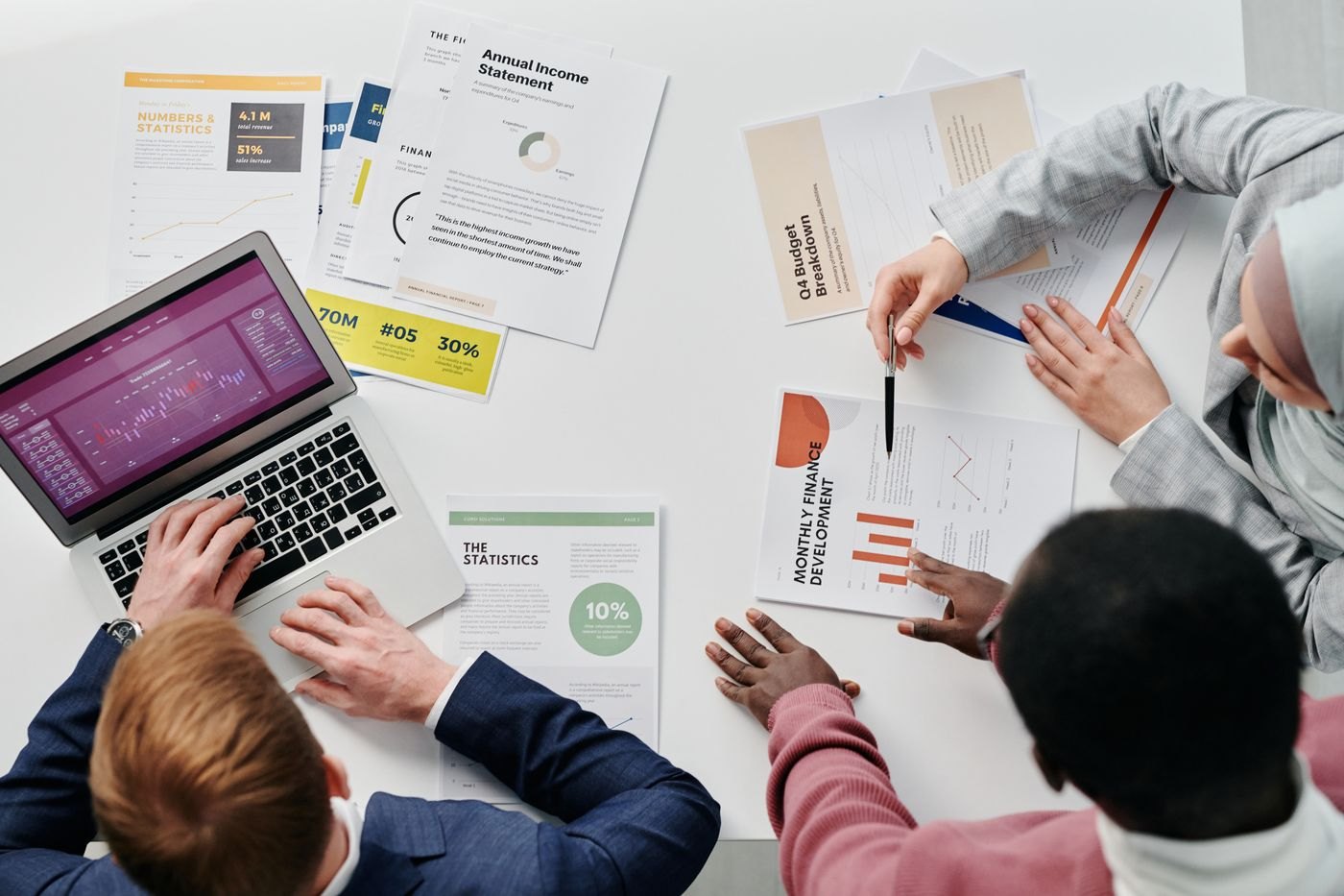 People reviewing papers together at a workplace